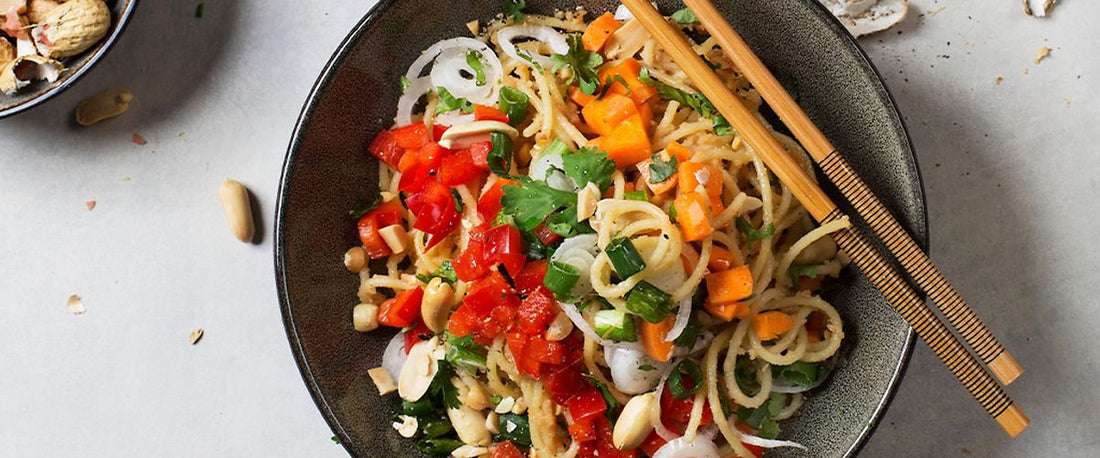 Vegan bowl with peanuts and pasta