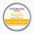 A tin container of Coconutoil Cosmetics Argan Bio Lip Balm on a light gray background.