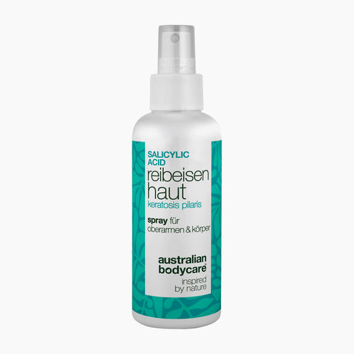 A white plastic spray bottle of Australian Bodycare Salicylic Acid Keratosis Pilaris Spray, featuring a white and teal label, on a light gray background.
