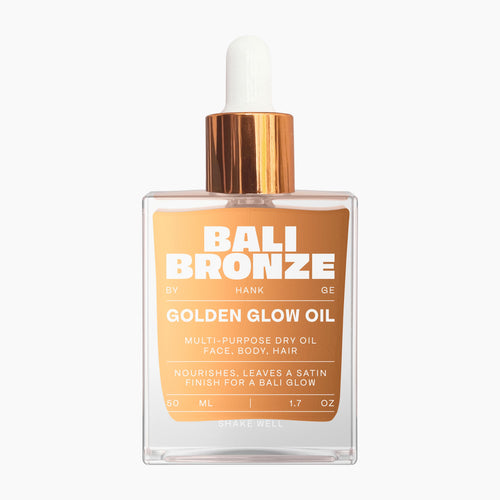 Bali Bronze Golden Glow Oil Multi-Purpose Dry Oil glass bottle on a light gray background.