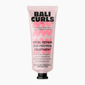 A pink squeeze tube of Bali Curls Total Repair SOS Protein Treatment with a black cap, centered on a light gray background.