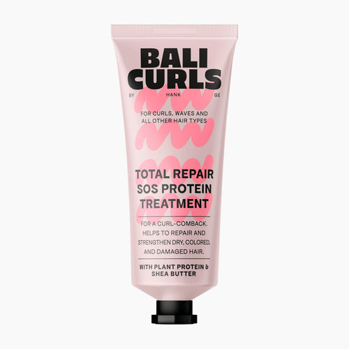 A pink squeeze tube of Bali Curls Total Repair SOS Protein Treatment with a black cap, centered on a light gray background.