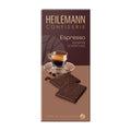 Heilemann Confiserie Espresso dark chocolate packaging with a glass of coffee and chocolate pieces.
