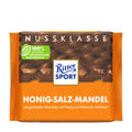 Packaging of Ritter Sport Nut Class Honey-Salt-Almond Milk Chocolate Bar, featuring the product name and the brand's logo in white and orange colors.
