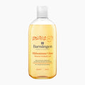 A 400ml clear plastic bottle of Barnangen Midsommar Glow Shower & Bath Gel, filled with a golden-yellow gel, on a clean white background.