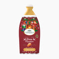 L'Angelica Limited Edition Happy Christmas Salted Caramel Bath & Shower Gel in a 500 ml bottle, featuring a festive red and gold holiday illustration on the label.