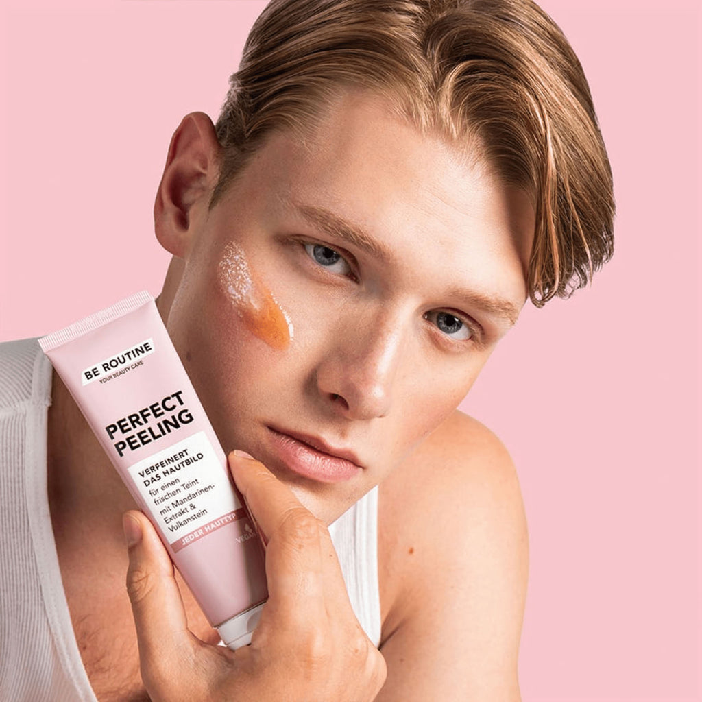 Person holding a tube of Be Routine Perfect Peeling with a pink background