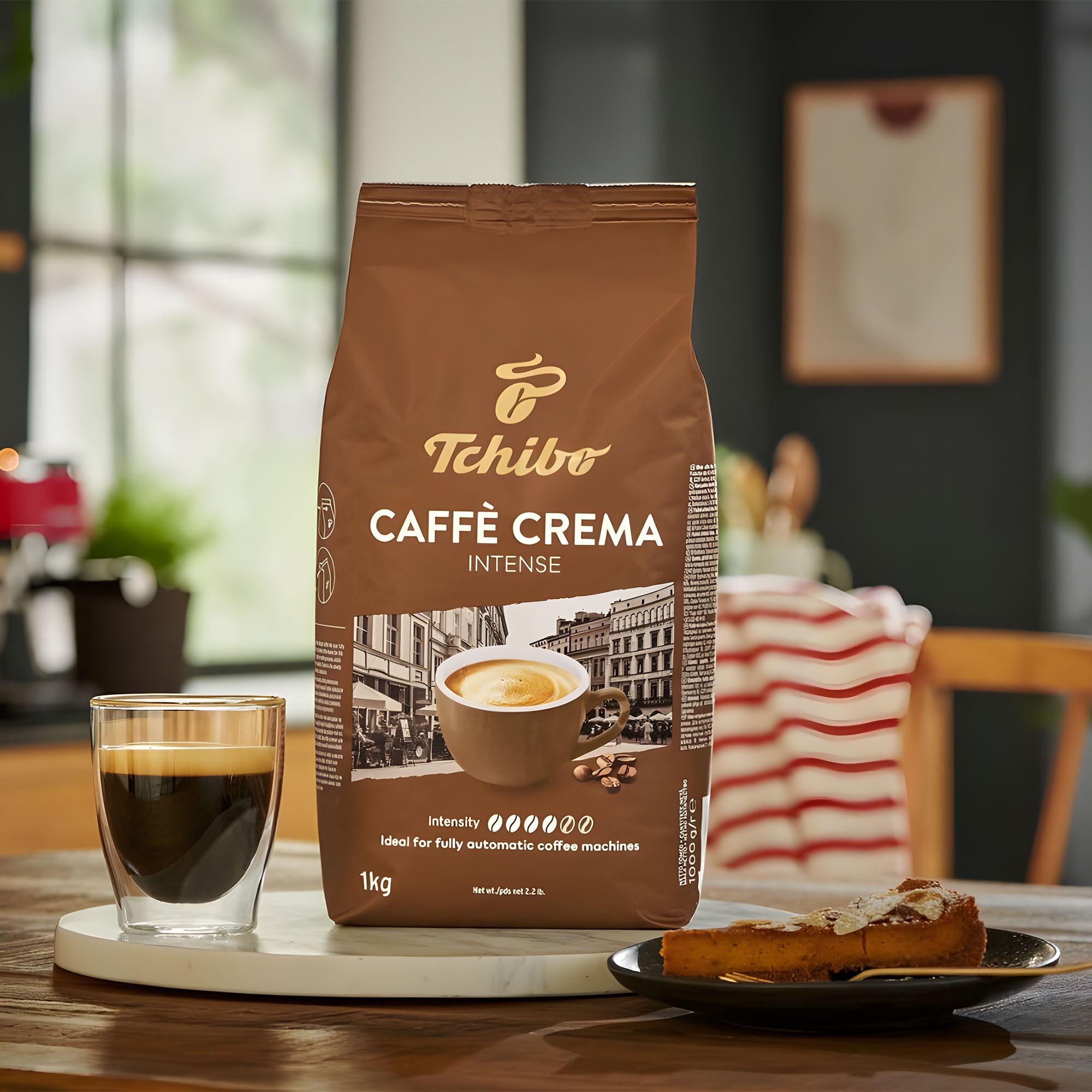 Tchibo Caffè Crema Intense coffee bag with a glass of coffee and toast on a table.