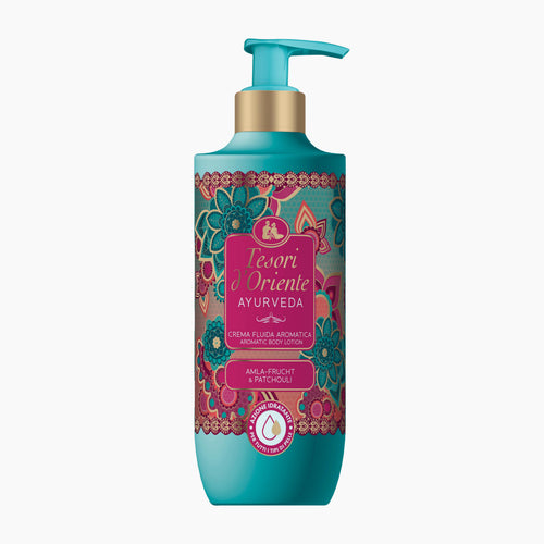 A bottle of Tesori d'Oriente Ayurveda Aromatic body lotion, featuring a turquoise and gold pump bottle with a colorful floral label, set against a plain white background.