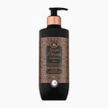 A 400ml pump bottle of Tesori d'Oriente Hammam body lotion. The bottle is matte black with a metallic rose gold collar and a detailed brown and gold ornate label.