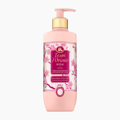 A 400ml pump bottle of Tesori d'Oriente Ikigai moisturizing body lotion in a soft pink color with a gold pump collar and a floral label, set against a plain white background.