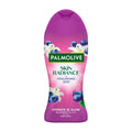 Palmolive Skin Radiance Blueberry & Lily body wash bottle with blueberries and lilies on a pink background