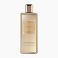 A bottle of Baylis & Harding The Edit Vanilla Seduction Luxury Body Wash, featuring a frosted beige bottle and a metallic gold cap, set against a plain white background.