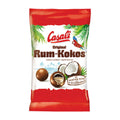 Packaging of Casali Original Rum-Kokos, showing the product name, a coconut palm, and a parrot, with an image of the dragees (round chocolate-covered snacks) and a rum-soaked coconut slice.