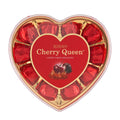 Heart-shaped gift box of Roshen Cherry Queen Cherry Liquor dark chocolate pralines with cherries covered in dark chocolate.