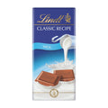 Packaging of Lindt Classic Recipe milk chocolate bar, showing the brand logo, chocolate pieces, and a splash of milk.