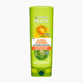 Garnier Fructis Sleek & Shine Conditioner bottle on a light gray background.
