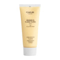 Pompure Orange & Ylang Ylang creamy face scrub tube on a white background.