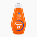 An orange bottle of Creme 21 Intensive Moisturizing Body Lotion for Ultra Dry Skin with a white cap, shown on a clean white background.