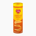 Schar Curvies Paprika flavored potato snack packaging on a light gray background.