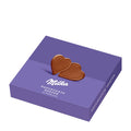 A purple gift box with a single heart-shaped chocolate piece on the cover, labeled 'Milka' and 'Alpine milk chocolate hearts'.