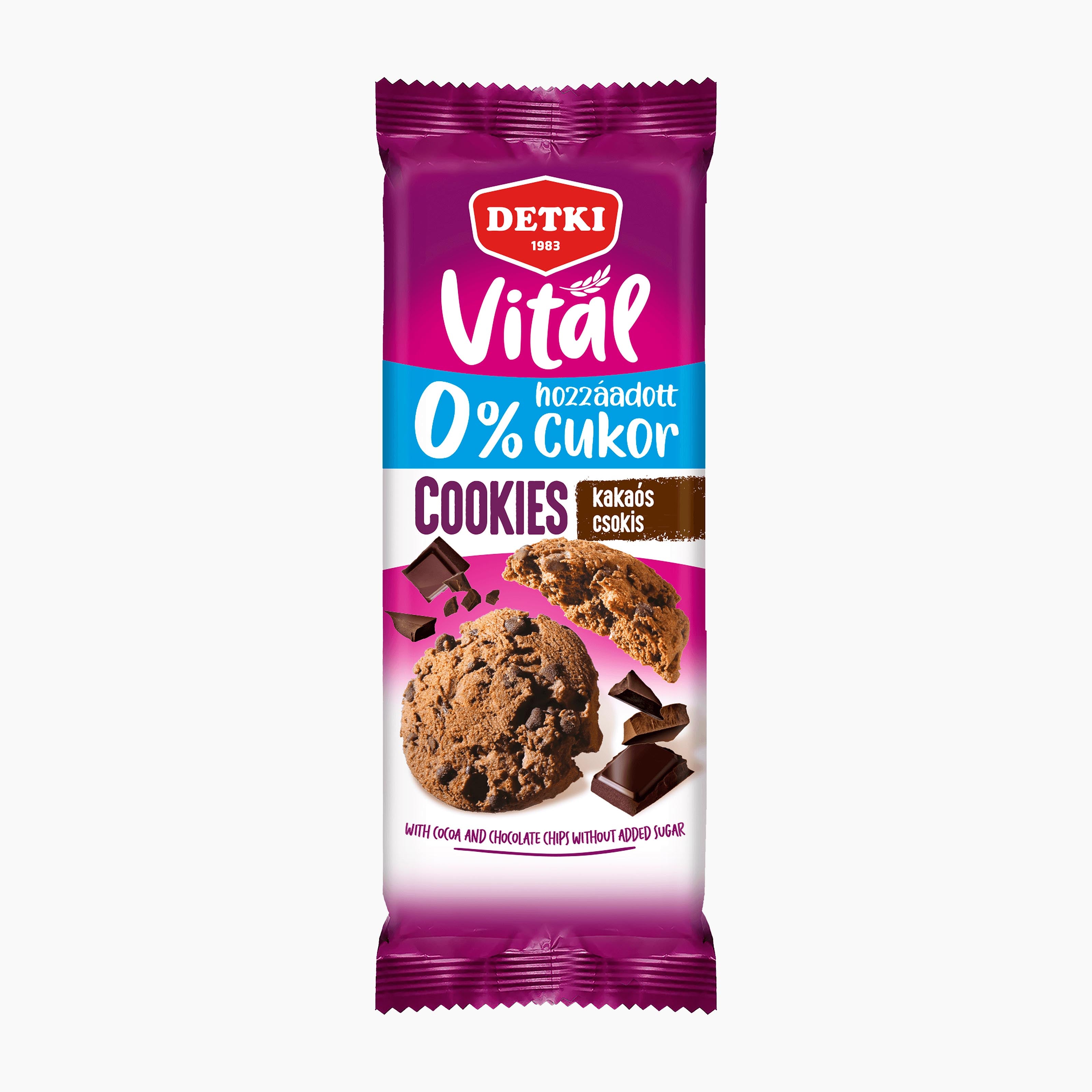 A single package of Detki Vital 0% added sugar cocoa and chocolate chip cookies, shown against a plain white background. The packaging is primarily purple and white with a blue banner, featuring a photo of a chocolate cookie on the front.