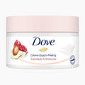 Dove Pomegranate & Shea Butter body scrub in a white jar with a light pink lid, on a light gray background.