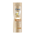 Dove Care + Visible Glow Self Tan Lotion Light to Medium bottle on a white background.