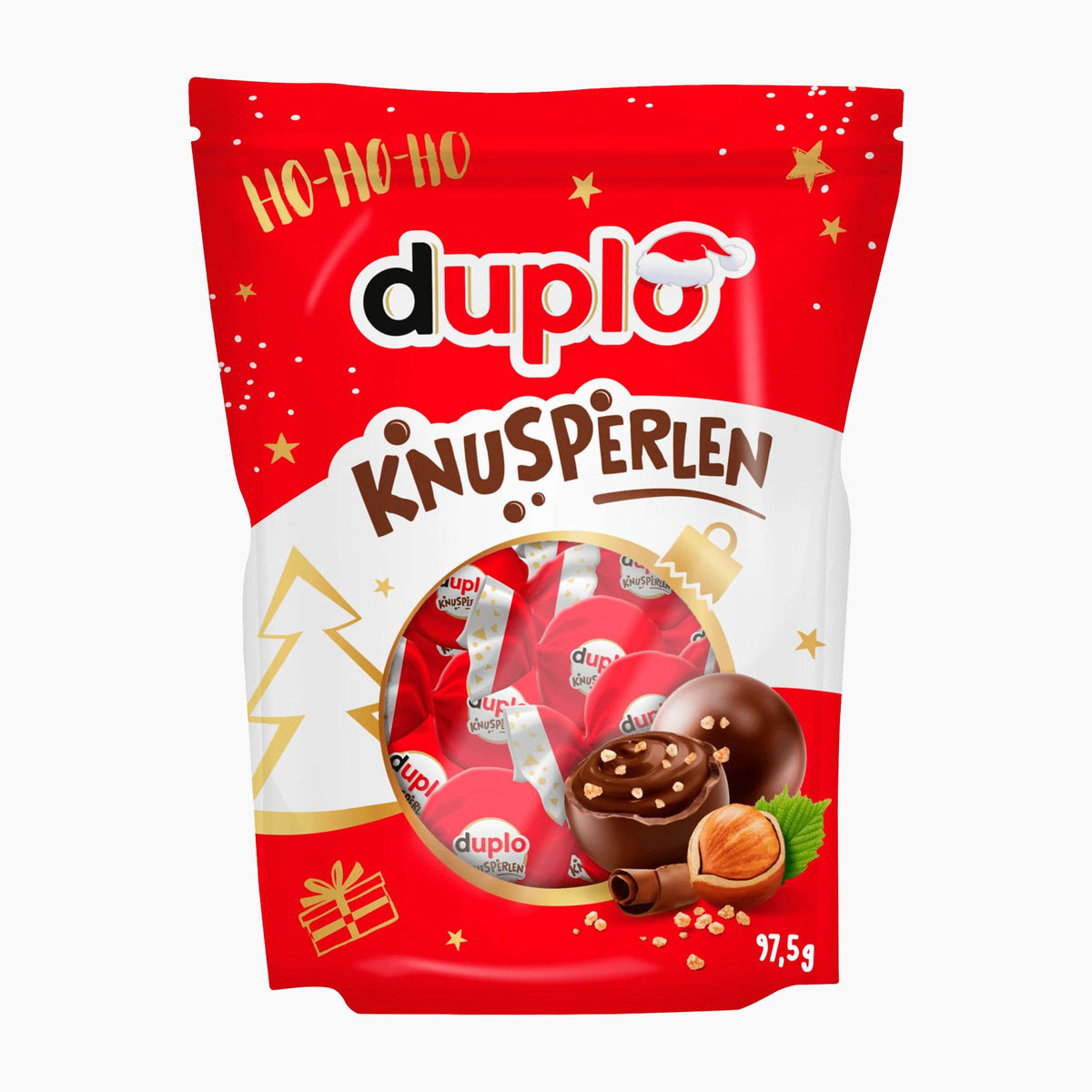 A red and white bag of Duplo Knusperlen holiday chocolate pralines, featuring illustrations of chocolate pralines, hazelnuts, and festive gold stars on a white background.