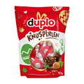 Red packaging of duplo Knusperlen with a clear window showing the product.