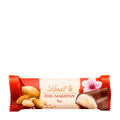 A wrapped Lindt Premium Marzipan bar with visible almonds and a flower decoration on the packaging.