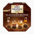 A 200g box of Trumpf Edle Tropfen in Nuss Klassische Brände Classic Spirits Pralines, featuring four types of spirits: Grappa, Brandy, Scotch Whisky, and Calvados, displayed on a clean white background.
