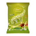 Lindt Lindor Pistachio Eggs chocolate pralines packaging with a gold bunny and pistachio design on a white background