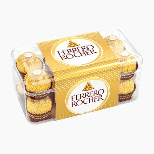 A clear plastic box of Ferrero Rocher chocolate pralines with a gold and white branded wrap, photographed on a light gray background.