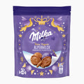 A purple stand-up pouch of Milka Feine Kugeln Fine Pralines Alpine Milk chocolate balls, featuring gold and purple decorative graphics and an illustration of two chocolate praline balls on a white background.