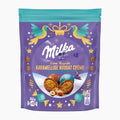 A 82g bag of Milka Fine Pralines Caramel Nougat Cream on a light gray background.