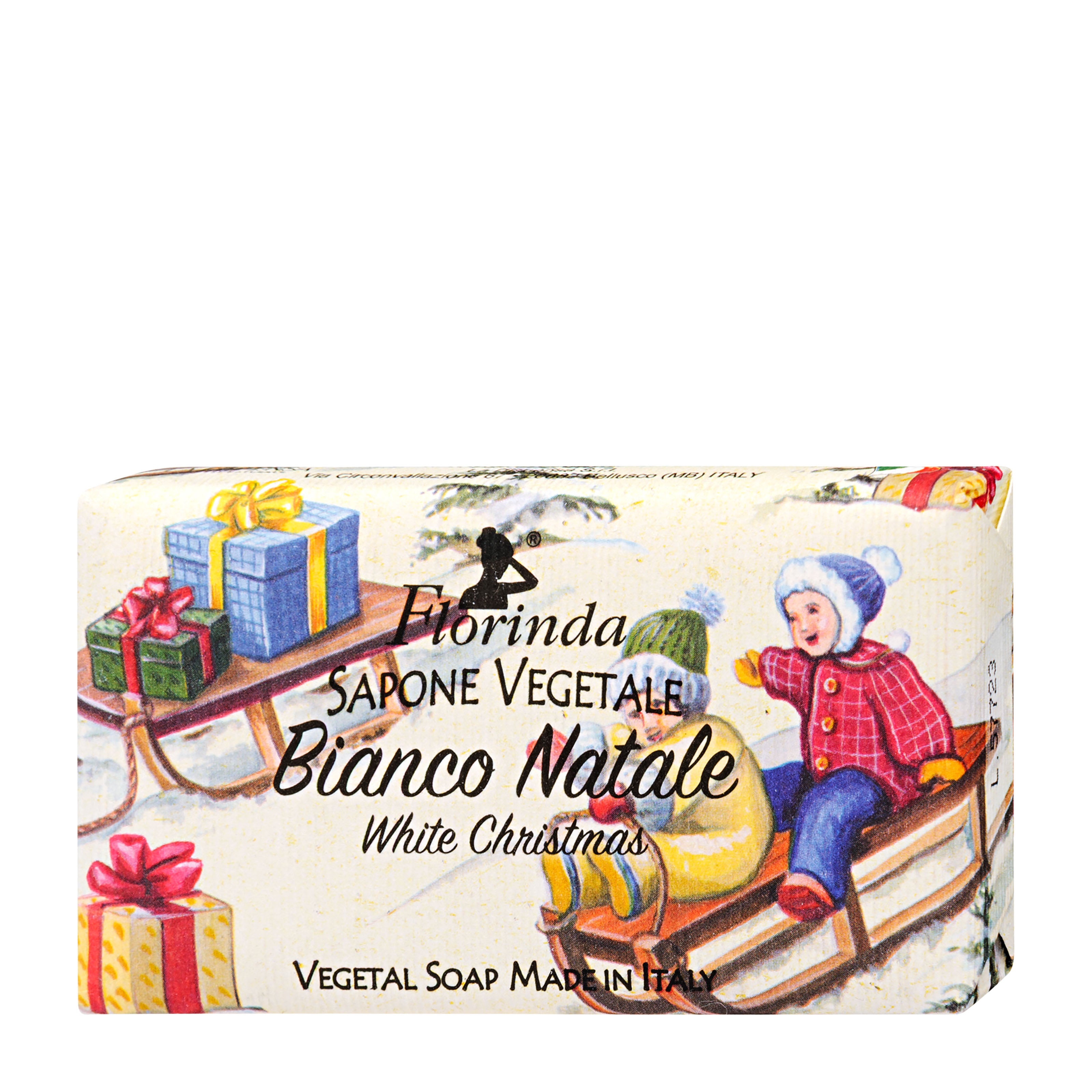 Bar of soap with Christmas-themed packaging featuring a child on a sled and presents.
