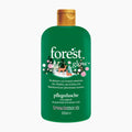Treacle Moon Forest Glow shower gel in a 500ml green bottle with a gold cap, featuring a festive Christmas tree and deer illustration on the label.