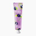 Frudia My Orchard Acai Berry Hand Cream tube on a light gray background.