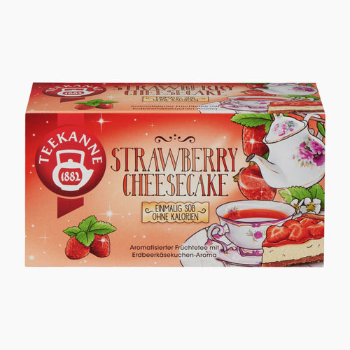 A rectangular box of TEEKANNE Strawberry Cheesecake flavored fruit tea, featuring a red and orange design with illustrations of strawberries, a teapot, a teacup with red tea, and a slice of cheesecake on a white background.