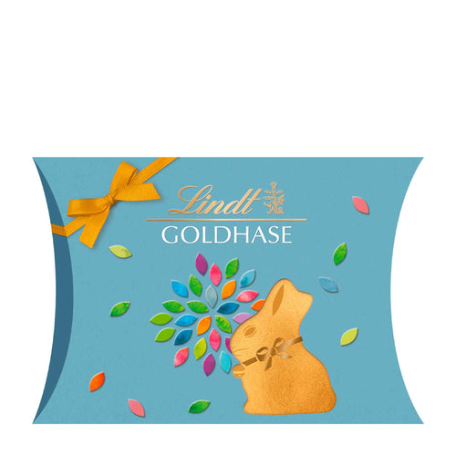 Lindt Gold Bunny Cut-Out Pillow Pack packaging with colorful design on a blue background