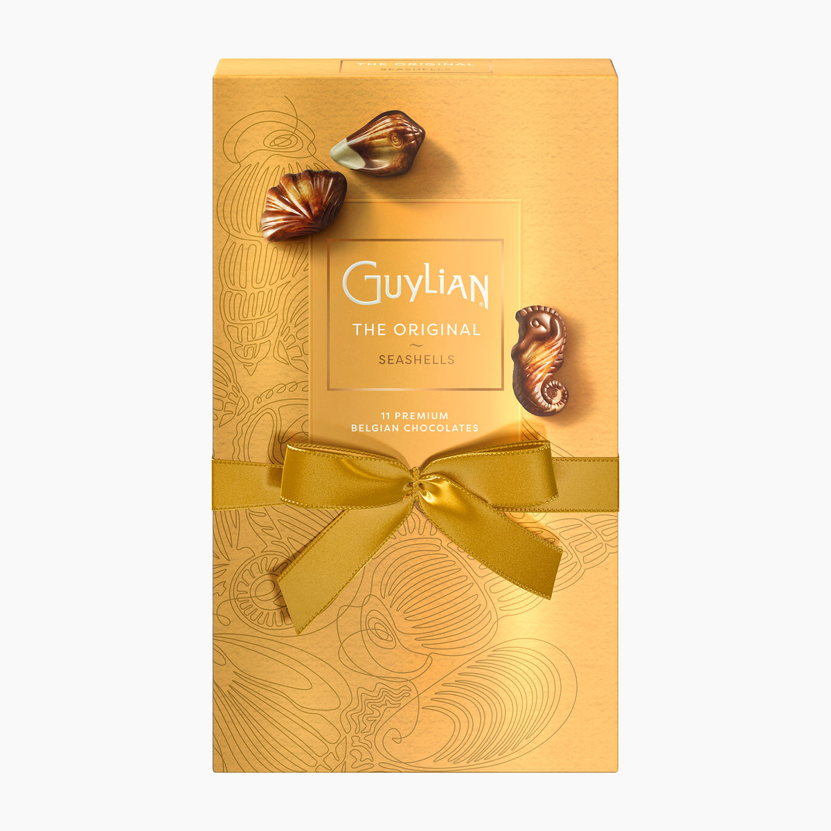 A gold-colored rectangular box of Guylian The Original Seashells chocolates, tied with a matching gold ribbon and bow, with two seashell-shaped chocolates displayed on top, set against a plain white background.