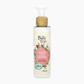 A bottle of Natürlich by evita Blackberry extract Hand Care Elixir with a white pump, a light wood-textured collar, and a cream-colored label decorated with pink and green botanical illustrations.