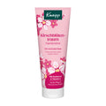 A pink squeeze tube of Kneipp Cherry Blossom Dream Hand Cream with white and pink floral illustrations, set against a plain white background.