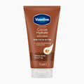 Vaseline Cocoa Hydrate Hand Cream in a 75ml squeeze tube, featuring a brown body with a blue Vaseline logo and a clear cap, on a light gray background.
