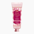 A pink squeeze tube of Tesori d'Oriente Ikigai Aromatic Hand Cream, featuring a floral pattern and a prominent magenta label, set against a plain white background.