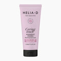 Helia-D Caring Touch Reparative Hand Cream in a light pink squeeze tube with a black cap, shown on a light gray background.