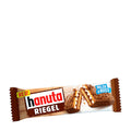 Packaging of Hanuta Riegel wafer bar showing the product name and a picture of the chocolate bar with hazelnut pieces and cream layers.