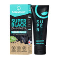 Happybrush Super Black Whitening toothpaste packaging and tube on a white background