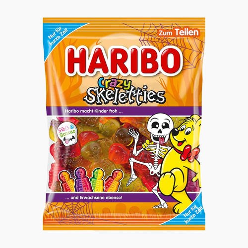 A package of Haribo Crazy Skeletties gummy candies, featuring a bright orange bag with a cartoon skeleton, a yellow bear, and a clear window showing the colorful gummy candies inside.